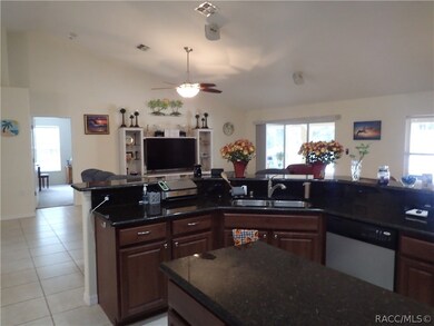 Kitchen view looking towards living room and door