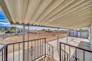 View of patio with a storage shed and an outdoor s