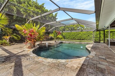 Outdoor pool with enclosure and a patio area