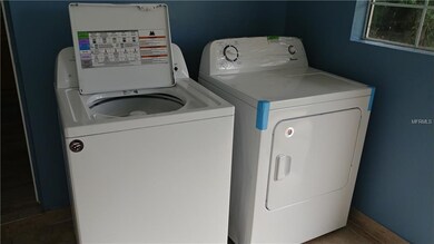 Washer dryer in laundry room.