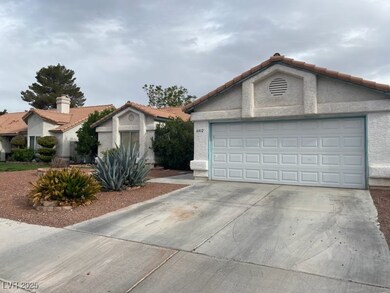 View of front of home with stucco siding, a tiled