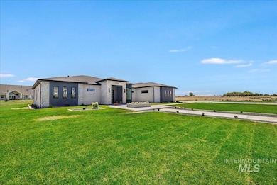 Rear view of property with a yard