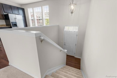 Stairway featuring carpet floors