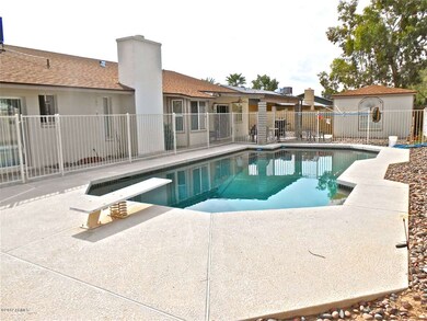 Pebble tec diving pool completely fenced