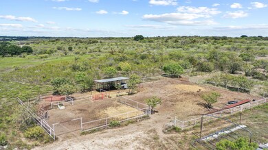 Birds eye view of property with a rural view