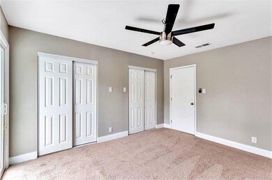 Unfurnished bedroom with two closets, light color