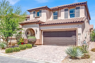 Mediterranean / spanish home featuring a tile roof