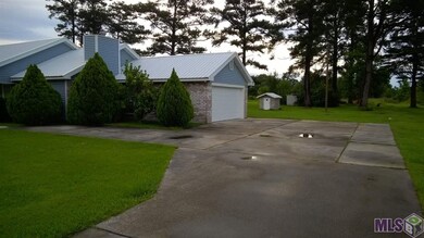 Metal roof, lots of parking, garage door opener