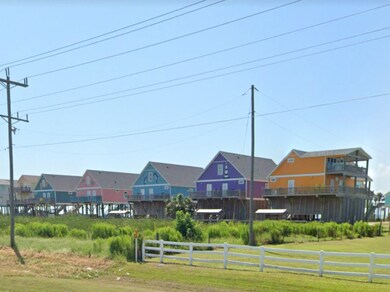 Colorful beach homes nearby.