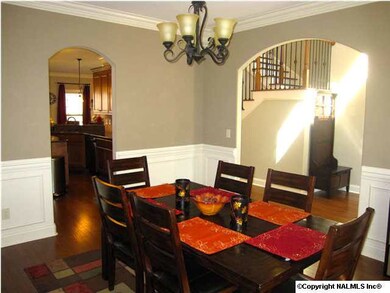 Alternate view of the Dining Room shows off those gorgeous archways! This is one of the first things you view when you enter this lovely home.