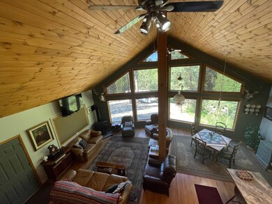 Main Living Area With Floor To Ceiling Windows & V