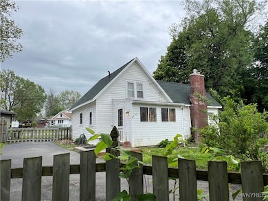 Fully fenced lot w/driveway on two streets.