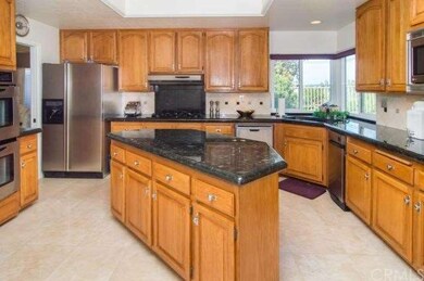 The kitchen is enhanced with upgraded granite coun