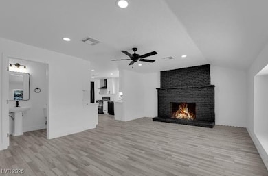 Unfurnished living room featuring a fireplace, a c