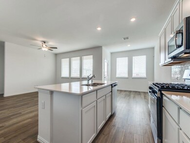 Large dining area, lots of countertop space, recess lighting, ceiling fan, huge walk-in pantry.