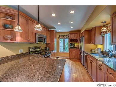 Kitchen. Beautiful cabinets and light fixtures!