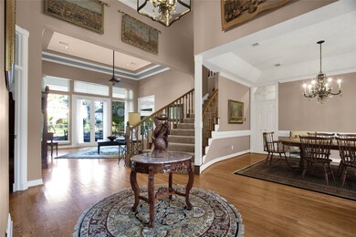 grand entry with high ceilings and elegant floorin