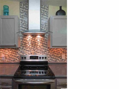 Take a look at this range with the updraft ! How fabulous and great use of space here in this kitchen you will be amazed at the storage and countertop space !