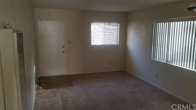 Main entry to living room of home (wall heater - t