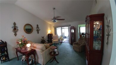 LIVING ROOM LEADING TO ENCLOSED PORCH