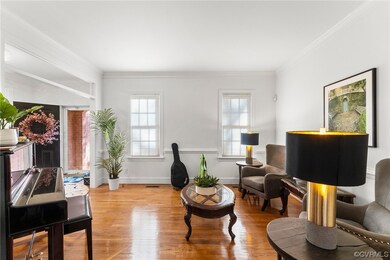 Living room with light hardwood / wood-style floor