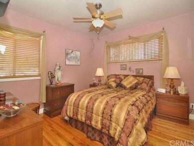 Master bedroom with closet organizers, hardwood fl