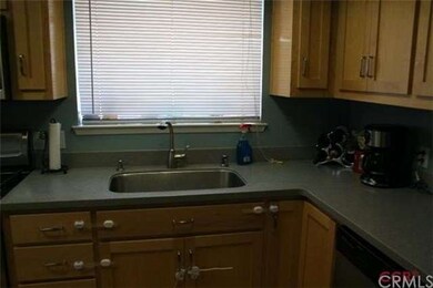 Newer Kitchen with Corian Counter Tops ad Maple Ca