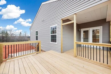 Covered Porch and Deck overlooking Large Homesite
