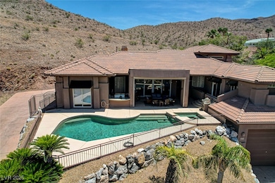 View of swimming pool with a mountain view, a pool