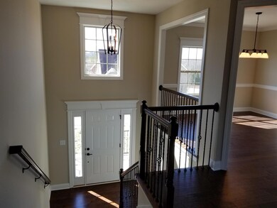 Airy and bright view given by the open 2 story tall foyer and classy oak abounds!