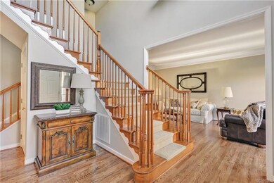 2-story foyer with newly refinished wood floor, fr