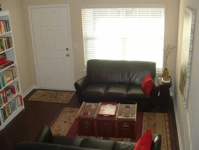 A view of the living room.  Hardwood floors.
