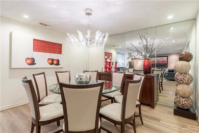 Dining space with a chandelier, light wood finished floors, and recessed lighting