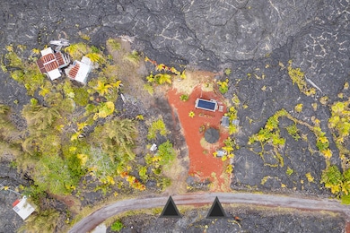 The property is partially cleared and includes some cinder and gravel added for a driveway and possible building pad.