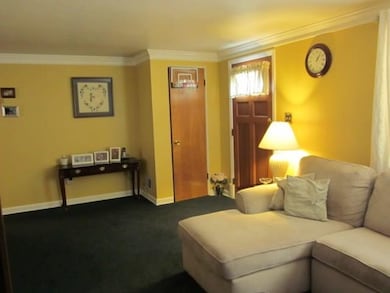 The lovely front door leads to the Living Room wit
