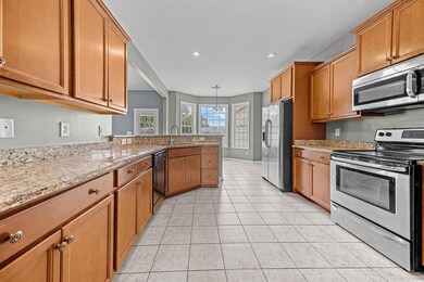Kitchen featuring light tile patterned flooring, p