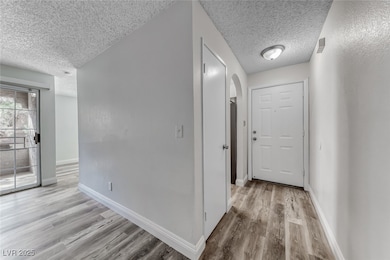 Entry with luxury vinyl plank floors, grey two ton