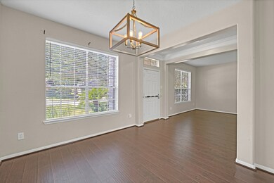 The formal dining room is to the right of the entry and has a new light fixture & access to the kitchen area.