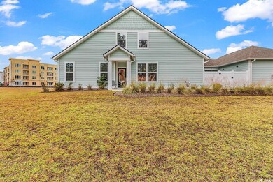 View of property with a front lawn