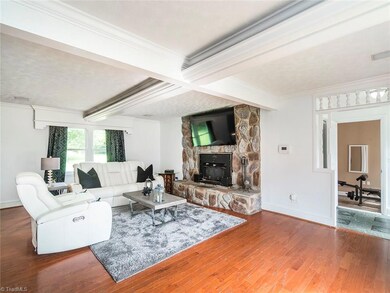 Living room with stone fireplace.