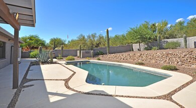 Stucco wall surrounds private backyard