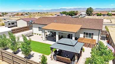Back of property featuring a gazebo, a fenced back