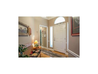 Inviting Entry with Hardwood Floors.