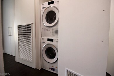 Washroom with stacked washer / dryer, a heating un