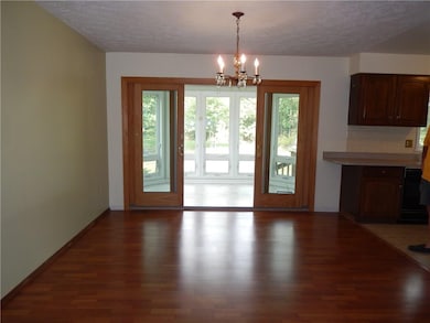 Dining room with new sliders to 3 season porch. An