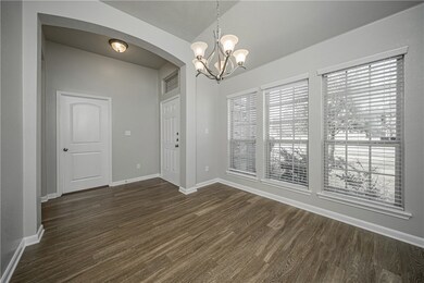Spare room featuring dark wood finished floors, a