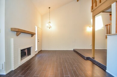 The gas fireplace features a beautiful white paint