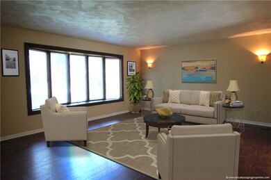 The large bay windows brighten up the family room 