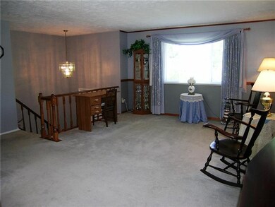 Entry open to living room! Large picture window pr