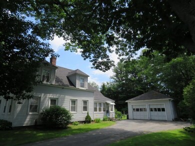 A paved driveway leading to a...